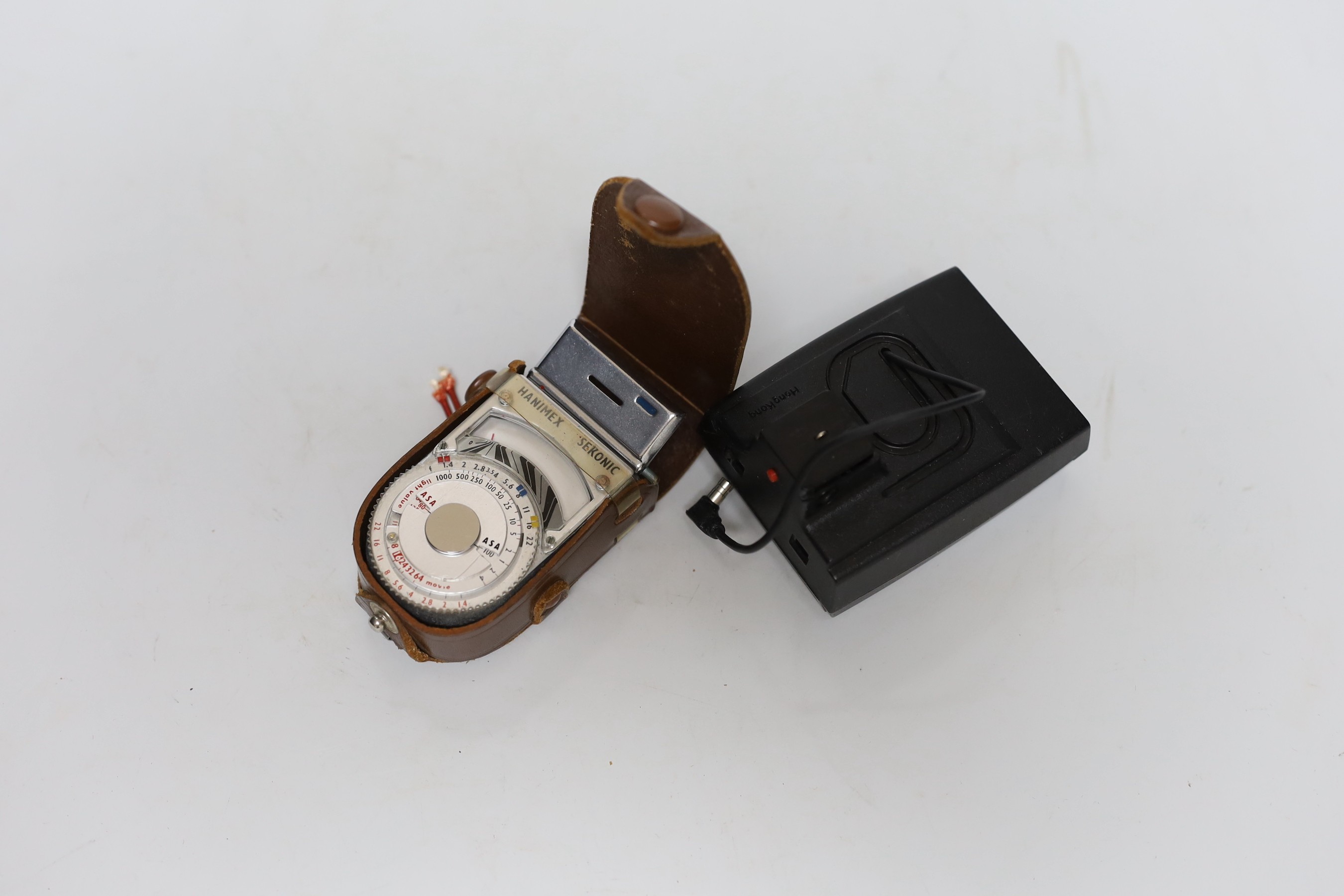 Three cameras, two cased plus a flash and light meter